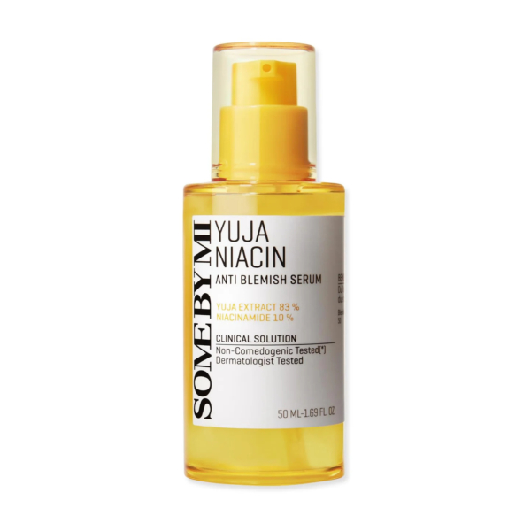 Un flacon de sérum anti-imperfections Yuja Niacin de SOME BY MI. Le flacon transparent au liquide jaune présente un texte mettant en valeur l'extrait de yuja (82 %) et la niacinamide (10 %). Il est indiqué que le produit est non comédogène et testé dermatologiquement. Dakar