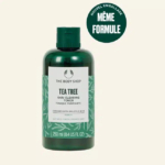 Flacon vert de tonique purifiant à l'arbre à thé The Body Shop, avec une étiquette blanche à motifs de feuilles. Le flacon est doté d'un bouchon vert. Le texte souligne la formule, mais dans un nouvel emballage. Contenance : 250 ml. Dakar
