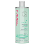 Un flacon vert d'Eau Micellaire Purifiante Topicrem AC Control, 400 ml. L'étiquette précise qu'elle contient 99 % d'ingrédients d'origine naturelle et convient aux peaux sensibles. Fabriqué en France. Dakar