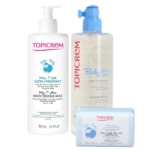 Coffret de soins pour bébé Topicrem comprenant trois produits : un grand flacon de lait hydratant, un flacon pompe de gel nettoyant et un pain de savon nettoyant doux. L'emballage présente des touches de bleu et une illustration de mouton. Dakar