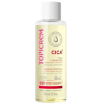 Un flacon de 100 ml d'huile concentrée Topicrem CICA+ pour peaux sensibles. L'étiquette met en avant 99 % d'ingrédients naturels, conçus pour atténuer les vergetures et les cicatrices. Le flacon est transparent avec un texte rose et noir. Dakar