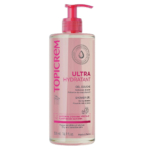Un flacon rose de 500 ml de gel douche Topicrem Ultra Hydratant avec pompe. L'étiquette, en anglais et en français, met en avant ses propriétés pour les peaux sèches et sensibles grâce à la glycérine végétale. Dakar