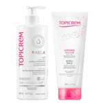 Deux produits de soin Topicrem : à gauche, le Lait Ultra-Hydratant Emla en flacon de 500 ml. À droite, le Gommage Douceur en tube de 200 ml. Les deux flacons sont blancs avec des touches de rose. Dakar