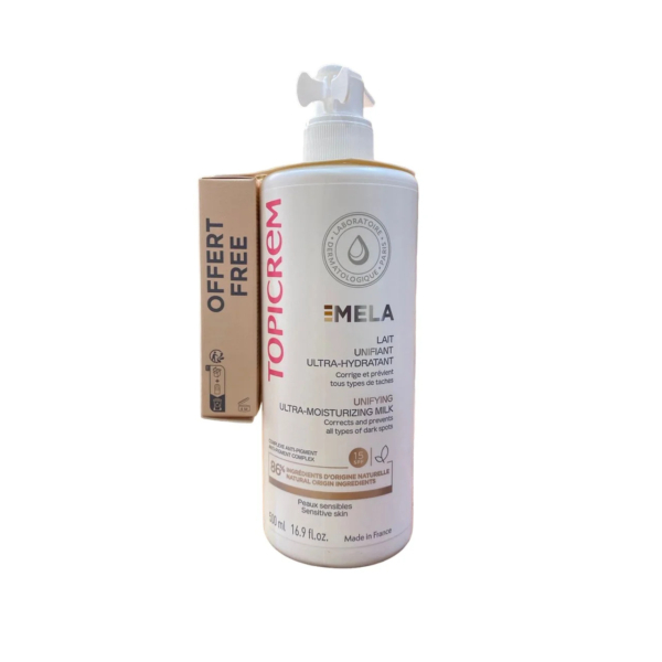 Flacon de Topicrem MELA Lait Ultra-Hydratant Unifiant avec pompe, étiqueté 500 ml. Une étiquette cadeau est apposée sur le côté, indiquant un article gratuit. Fabriqué en France. Dakar
