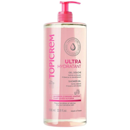 Flacon transparent de gel douche Topicrem Ultra Hydratant avec pompe rose, d'une contenance de 1000 ml. L'étiquette mentionne « Glycérine végétale » et indique qu'il est destiné aux peaux sèches et sensibles. Fabriqué en France. Dakar