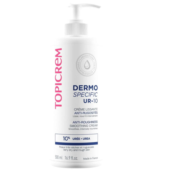 Flacon blanc de crème lissante anti-rugosités TOPICREM Dermo Specific UR-10 avec pompe. L'étiquette est rose et grise. Contient 10 % d'urée, idéale pour les peaux très sèches et rugueuses. Contenance : 500 ml. Fabriqué en France. Dakar