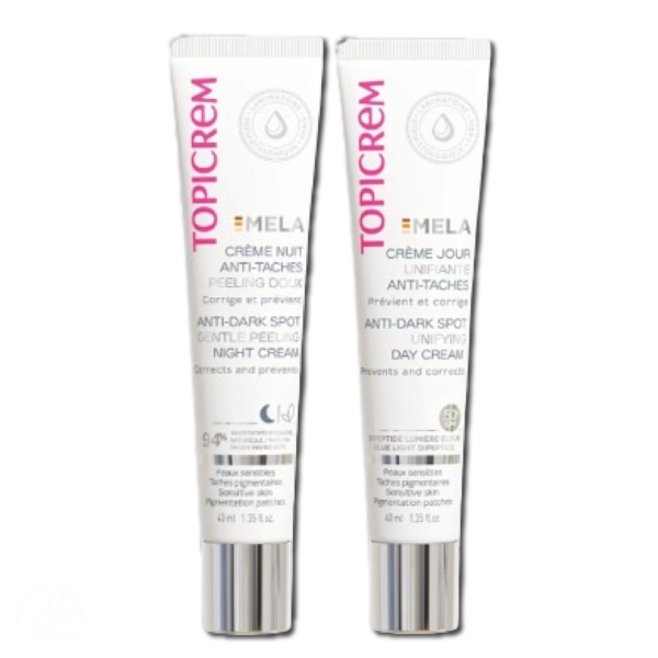 Deux tubes étiquetés « Topicrem ». Le tube de gauche est « Crème de Nuit Peeling Douceur Anti-Taches » et celui de droite est « Crème de Jour Unifiante Anti-Taches ». Les deux tubes ont un fond blanc et un texte rose. Dakar