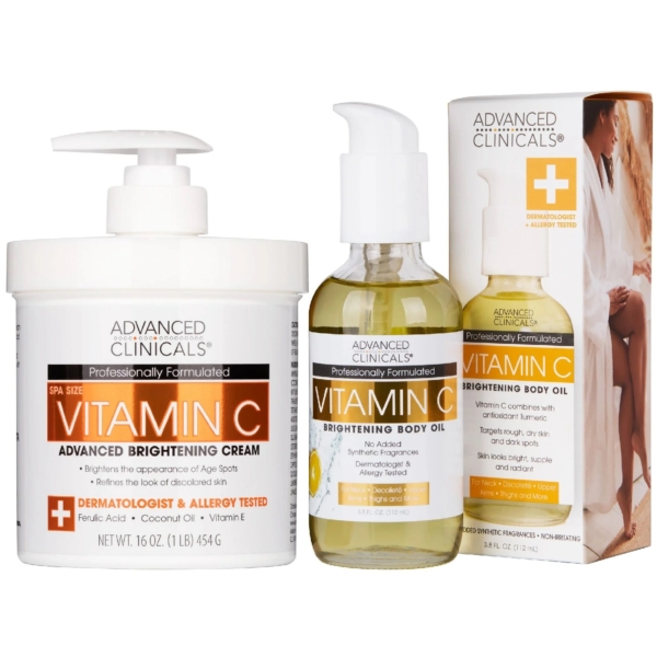 Le Coffret Crème Corporelle à la Vitamine C + Huile Corporelle ADVANCED CLINICALS comprend un grand pot blanc de crème, un flacon pompe d'huile corporelle et une boîte assortie, tous dotés d'étiquettes orange et blanches. Dakar