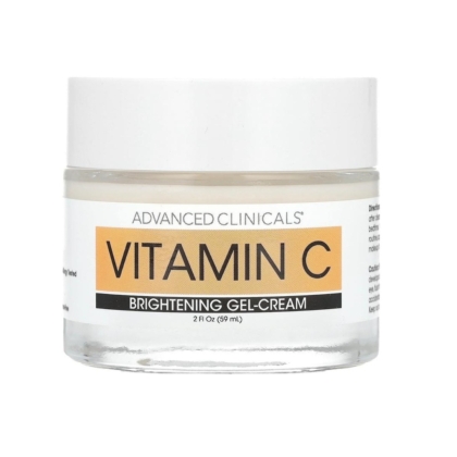 Un pot transparent d'Advanced Clinicals Gel Crème Éclaircissant Visage à la Vitamine C, 74 ml, avec un couvercle blanc et une étiquette comportant un texte orange et noir. Dakar