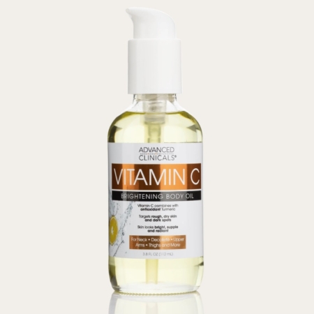 Un flacon transparent de Advanced Clinicals Huile Corporelle Éclaircissante à la Vitamine C 112 ml avec une pompe blanche et une étiquette orange-blanche, contenant 3.8 fl oz (112 ml) de produit. Dakar