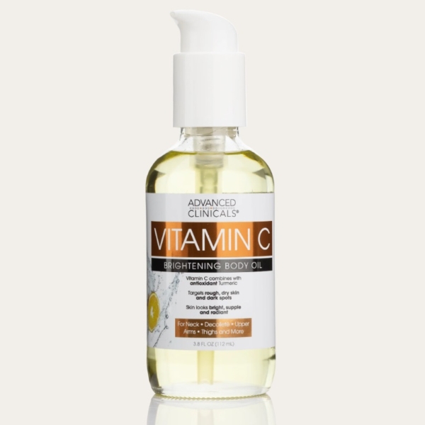 Un flacon transparent de Advanced Clinicals Huile Corporelle Éclaircissante à la Vitamine C 112 ml avec une pompe blanche et une étiquette orange-blanche, contenant 3.8 fl oz (112 ml) de produit. Dakar