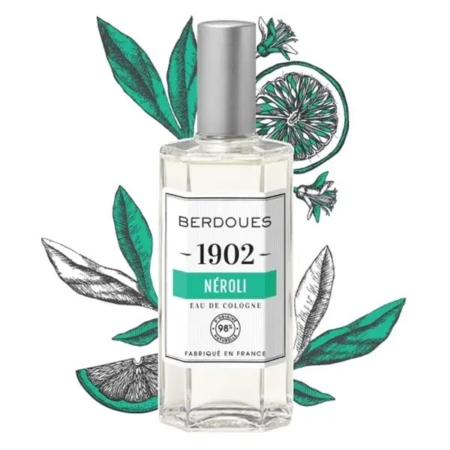 Un flacon en verre transparent de BERDOUES Néroli Eau de Cologne 125 ml présente une étiquette blanche avec des accents verts, complétant le fond illustré de feuilles vertes et de tranches d'agrumes, mettant en valeur son thème parfumé. Dakar