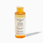 Un flacon en plastique transparent de 100 ml d'huile capillaire BYPHASE HUILE DE SOIN SUBLIMATRICE NOIX DE COCO avec liquide orange, bouchon blanc et étiquette française, idéal pour nourrir vos cheveux. Dakar
