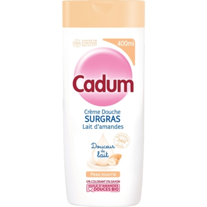 Un flacon de 400 ml de Cadum Surgras Lait de Douche d'Amande Peaux Sèches, avec un bouchon beige clair et une étiquette sur le thème de l'amande française - une crème de douche douce pour les peaux sèches et une alternative à la Crème Douche Dove. Dakar