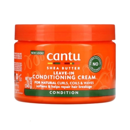 Pot orange vif de 340 g de la Crème Revitalisante Après-Shampoing Sans Rinçage Cantu, idéale pour les boucles, les ondulations et les frisottis naturels. L'étiquette souligne ses bienfaits adoucissants et réparateurs anti-casse. Dakar
