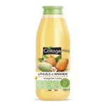 Le flacon de 560 ml du Gel Douche Cottage à l'huile d'amande, orné d'amandes et de fleurs d'amandier, est doté d'un bouchon vert et est fabriqué à 97 % à partir de matériaux recyclés. Le texte est élégamment présenté en français. Dakar