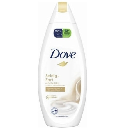 Une bouteille blanche de 250 ml de Dove Gel Douche Douceur Soyeuse avec un bouchon doré, un logo Dove bleu et un graphisme tourbillonnant présente 0 % de sulfates, une crème hydratante, ainsi que des autocollants d'information verts et violets sur l'étiquette. Dakar