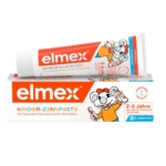 Une boîte et un tube de pâte dentaire Elmex Kinder-Zahnpasta, conçus pour les enfants de 2 à 6 ans, représentant une souris se brossant les dents. L'emballage est blanc avec des touches d'orange et comporte un texte en allemand sur la protection contre les caries des dents de lait. Dakar
