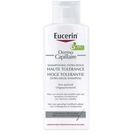 Un flacon de 250 ml de Shampoing Extra-Doux Haute Tolérance Eucerin DermoCapillaire, non parfumé pour cuirs chevelus très sensibles, présente une formule inspirée d'Evashair et un emblème vert avec une revendication 100%. Dakar