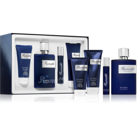 Un coffret de parfums Faconable Riviera présenté dans un élégant coffret. Il comprend un flacon d'eau de Cologne, un lait pour le corps, un gel douche et d'autres articles de toilette. L'emballage est principalement bleu marine avec une étiquette blanche. Dakar