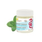 Un petit pot de baume chinois Fleurance Nature, étiqueté en français et en espagnol, représentant un dragon rouge. À côté du pot, deux feuilles de menthe fraîche évoquent les vertus médicinales du baume. Le pot contient 30 ml de baume. Dakar