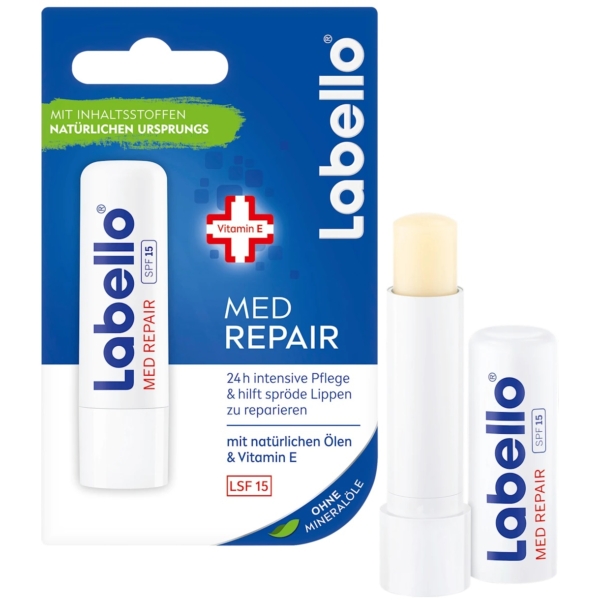 L'image présente un baume à lèvres Labello Soin des Lèvres Spf15 Med Repair avec un emballage bleu et blanc, mettant en valeur « soin intensif 24h » à la vitamine E. Le baume est partiellement débouché et le texte allemand met l'accent sur ses ingrédients naturels. Dakar