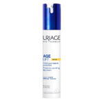 Un flacon de crème de jour Uriage Age Lift SPF 30 avec un bouchon pompe bleu. L'étiquette indique le nom du produit et ses bienfaits, tels que « Crème de jour protectrice et lissante » et « Rides – Fermeté ». Convient à tous les types de peau. Dakar