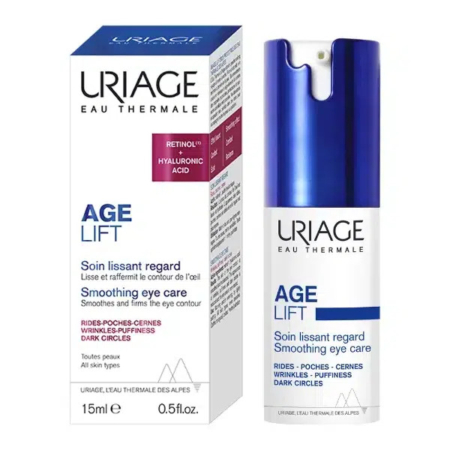 Image de l'emballage du Soin Yeux Lissant Age Lift d'Uriage. La boîte est blanche avec un texte bleu, rouge et noir mettant en valeur les ingrédients clés : le rétinol et l'acide hyaluronique. Le flacon du soin, à côté de la boîte, est blanc avec un bouchon bleu et un texte similaire. Dakar