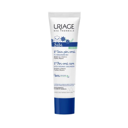 Un tube de Crème Péri-Buccale Uriage Bébé 1er Soin Péri-Buccal se dresse sur un fond blanc. L'emballage est blanc avec des touches de bleu et un texte orné d'illustrations florales. L'étiquette met en valeur l'edelweiss bio et une formule apaisante et réparatrice. Dakar