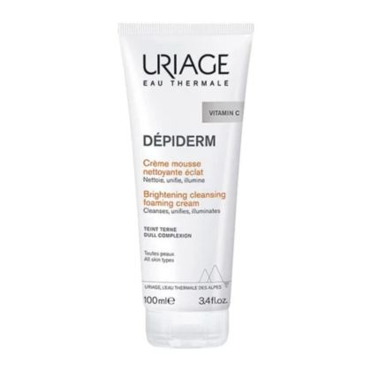 Un tube de Crème Moussante Nettoyante Éclat Uriage Dépiderm à la Vitamine C, conçu pour les teints ternes et tous types de peaux. Ce tube blanc avec inscriptions noires et orange contient 100 ml. Dakar