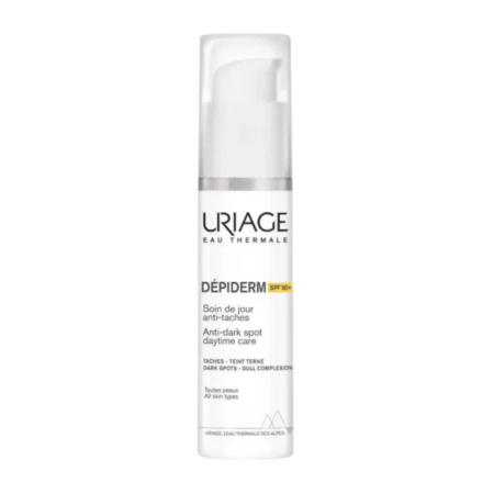 Flacon blanc d'Uriage Dépiderm Soin Jour Anti-Taches SPF 50, muni d'une pompe. L'étiquette est en français et en anglais. Ce produit cible les taches brunes et le teint terne, et convient à tous les types de peau. Dakar