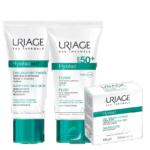L'image présente trois produits de soin Uriage : Hyseac Mat' Émulsion Matifiante, Hyseac Fluide SPF50+ et le Pain Dermatologique Hyseac. Tous les produits sont présentés dans un emballage blanc aux touches de vert. Dakar