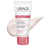 Tube de Crème Anti-Rougeurs Roséliane d'Uriage sur fond blanc. Ce produit, qui prétend apaiser, hydrater et atténuer les rougeurs, est destiné aux peaux sensibles sujettes aux rougeurs. La crème est présentée derrière le tube. Dakar