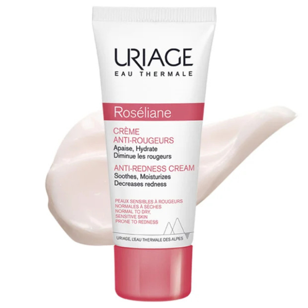 Tube de Crème Anti-Rougeurs Roséliane d'Uriage sur fond blanc. Ce produit, qui prétend apaiser, hydrater et atténuer les rougeurs, est destiné aux peaux sensibles sujettes aux rougeurs. La crème est présentée derrière le tube. Dakar