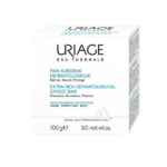 Emballage du Pain Dermatologique Extra-Gros Uriage Eau Thermale. Texte en français et en anglais mettant en avant ses fonctions : nettoie, nourrit, protège. Conçu pour les peaux sensibles du visage et du corps. Poids net : 100 g. Dakar