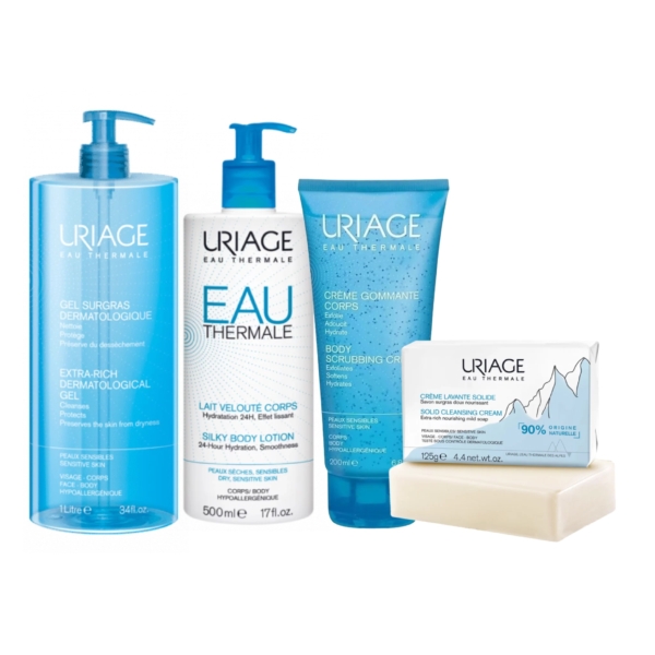 Une collection de soins Uriage comprenant un grand flacon pompe de gel dermatologique, un flacon de lait corporel, un tube de crème exfoliante et un pain de savon nettoyant. Tous les articles sont dotés d'étiquettes bleues et blanches. Dakar