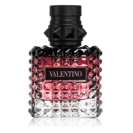 Un flacon de parfum Valentino en verre texturé et clouté. Le flacon est principalement transparent, passant du noir au rose sur le dessus. Il est doté d'un bouchon noir clouté. L'étiquette porte l'inscription « Valentino » en lettres blanches sur fond rose. Dakar
