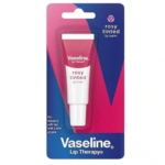 Emballage du baume à lèvres teinté rosé Vaseline Lip Therapy. Le tube est rose et blanc, sous blister. Le texte indique qu'il offre des lèvres instantanément douces avec une touche de rose. Dakar