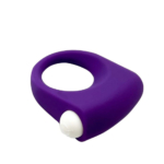 Un anneau en silicone violet auquel est fixé un petit bouton ou une capsule blanche, probablement un vibrateur. Son corps légèrement incurvé assure une prise en main ergonomique. Sa texture est lisse et douce. Dakar