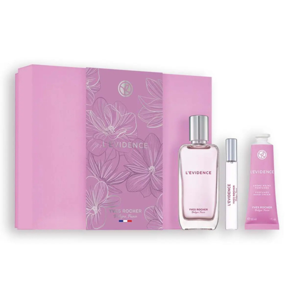 Coffret cadeau rose avec le parfum L'Évidence d'Yves Rocher. Il comprend un coffret rectangulaire au motif floral, un flacon de parfum en verre transparent, un petit tube et un élégant vaporisateur. L'emballage présente de délicats motifs floraux et un logo discret. Dakar