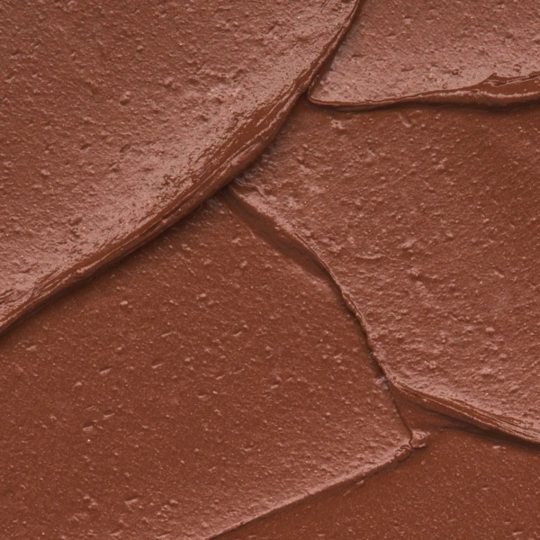 Gros plan d'une pâte à tartiner au chocolat onctueuse et crémeuse tourbillonnée en couches épaisses, sa finition brillante et sa texture impeccable rappelant Essence Cosmetics Stick Bronzeur Scintillant Parfumé Noix Coco Eclat Estival 20 Holiday Glow 5,5 g. Dakar