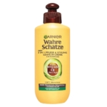 Un flacon jaune de Garnier Crème Nutrition Cheveux Très Secs Avocat Karité Sans Rinçage Ultra Doux 200 ml, pour les cheveux très secs, contient de l'huile d'avocat et du beurre de karité ; le bouchon et l'étiquette sont bruns avec des accents verts. Dakar