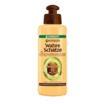 Flacon beige de Garnier Traitement Capillaire sans Rinçage à l'Avocat 200 ml à l'huile d'avocat, au beurre de karité et à la pompe marron. Inspiré de Fructis Hair Food, il est idéal pour les cheveux secs, ternes ou bouclés. Texte de l'étiquette en allemand. Dakar