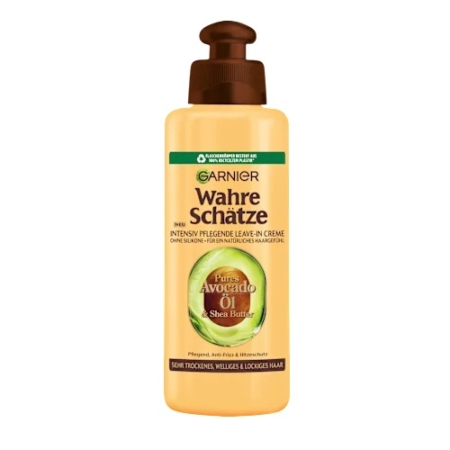 Flacon beige de Garnier Traitement Capillaire sans Rinçage à l'Avocat 200 ml à l'huile d'avocat, au beurre de karité et à la pompe marron. Inspiré de Fructis Hair Food, il est idéal pour les cheveux secs, ternes ou bouclés. Texte de l'étiquette en allemand. Dakar