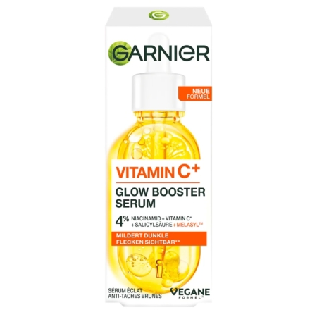 Vue de face d'une boîte de Garnier Skinactive Sérum Anti Tache à la Vitamine C avec un flacon compte-gouttes de liquide jaune. L'emballage met en avant la niacinamide, l'acide salicylique, le Melasy™, et revendique une réduction visible des taches brunes. Dakar