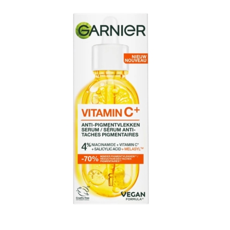 Une boîte de Garnier Skinactive Sérum Anti Tache à la Vitamine C, avec une image de flacon compte-gouttes, une étiquette végétalienne et des détails mettant en évidence 4 % de niacinamide, de vitamine C et de mélasyl pour aider à réduire les taches brunes. Dakar