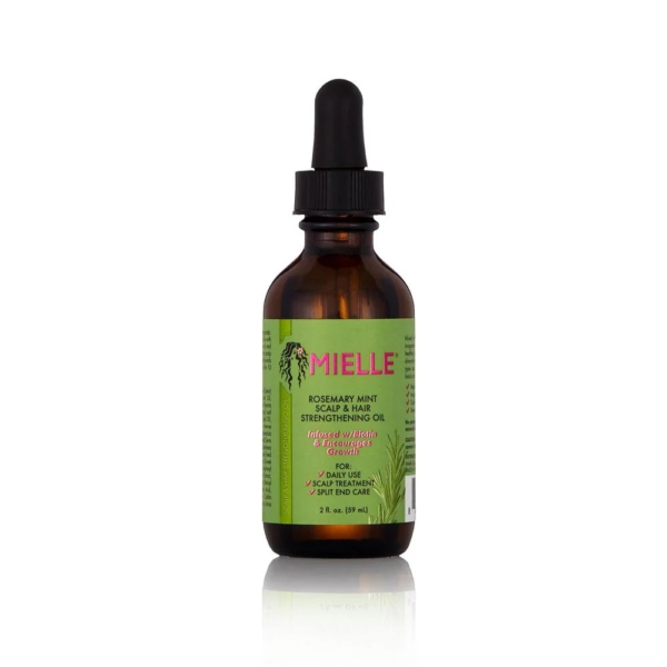 Un flacon compte-gouttes en verre brun étiqueté « MIELLE ORGANICS Huile Fortifiante au Romarin 59 ml » avec des accents verts et roses se trouve à côté de Crème of Nature Pure Honey Après Shampooing sur un fond blanc. Dakar