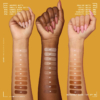 Trois branches aux teintes de peau variées présentent des échantillons de teintes Nyx Fond de Teint Liquide Spf30 Buttermelt Glaze Longue Durée 30 ml, numérotées, sur un fond moutarde. Chaque branche présente une palette allant du clair au foncé. Dakar
