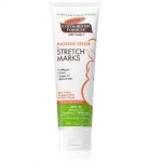 Tube de 125 g de crème de massage anti-vergetures Palmer's Pregnancy Cocoa Butter Formula, au collagène, à l'élastine, à l'huile d'argan et au beurre de karité. Sur le devant, une femme enceinte est représentée et le produit est sans huile minérale, sans parabènes ni phtalates. Dakar