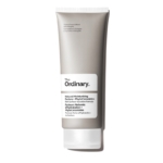 Un tube argenté et blanc de The Ordinary Crème Visage Facteurs Naturels d'Hydratation PhytoCéramides 30 ml se dresse debout sur un fond blanc, avec les détails du produit en anglais et en français sur l'étiquette. Dakar